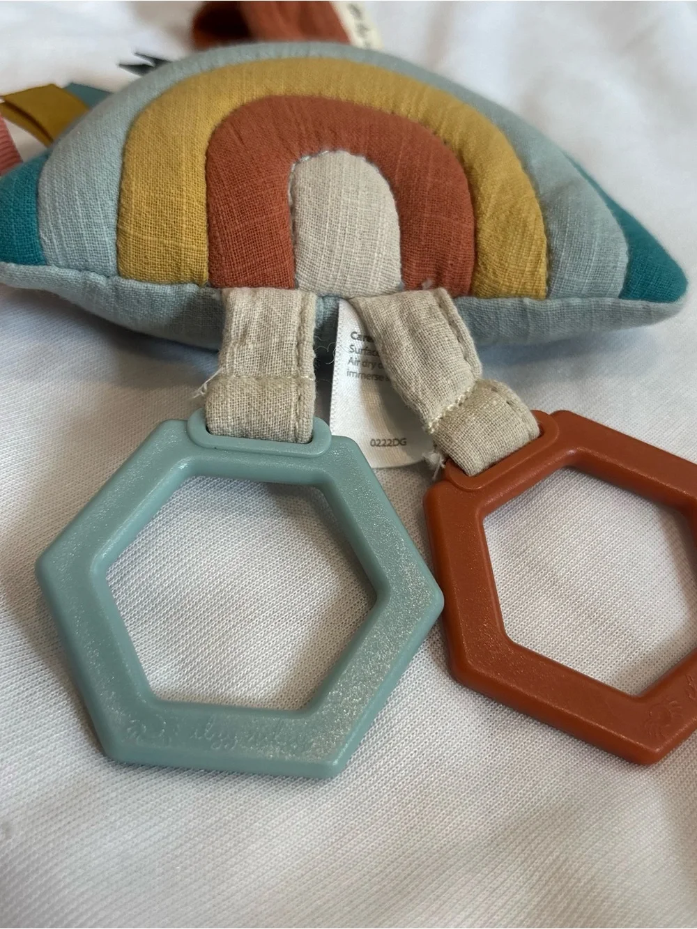 Itzy Ritzy Rainbow Teether Toy in Teal, Mustard & Rust